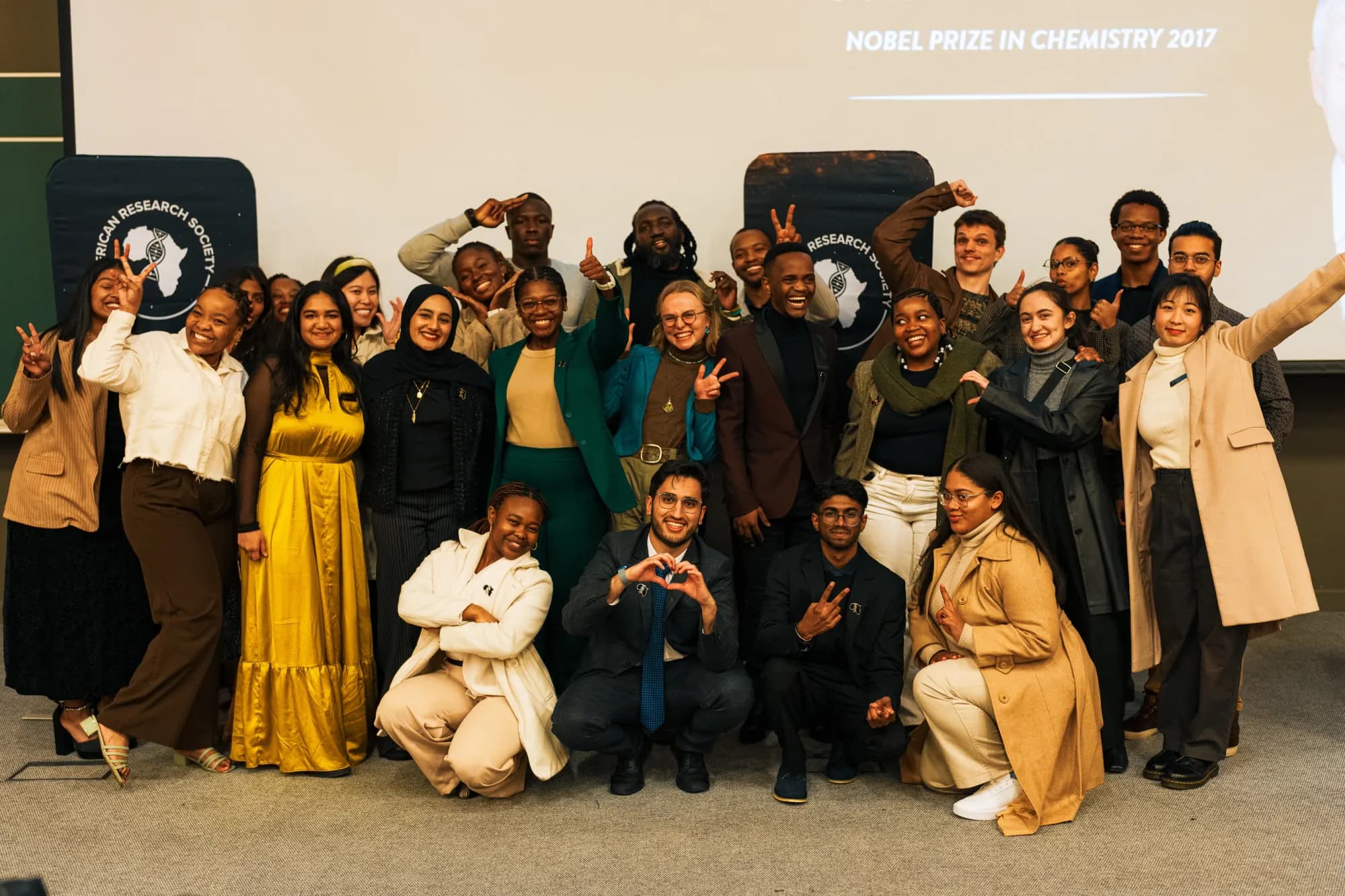 Large group photo of ARS members and guests celebrating at a Nobel Laureate evening